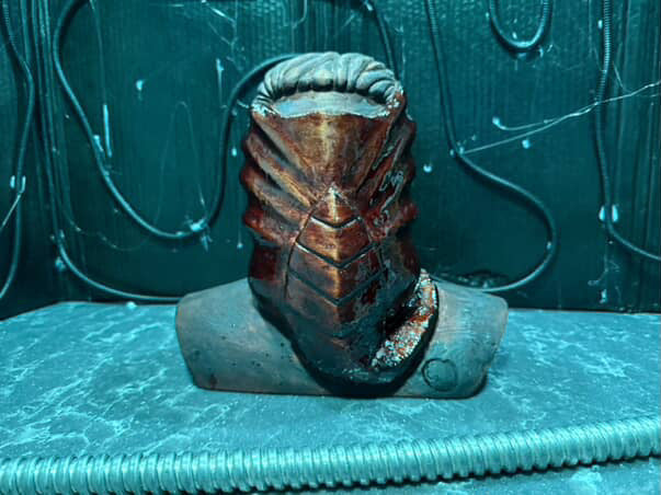 Front view of an Alien-inspired carved mask form by Ben Durfee