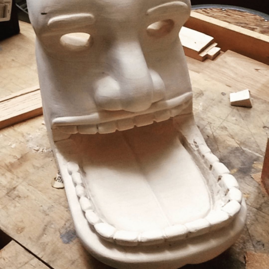 Unfinished carved character with an exaggerated open mouth by Beave the Builder
