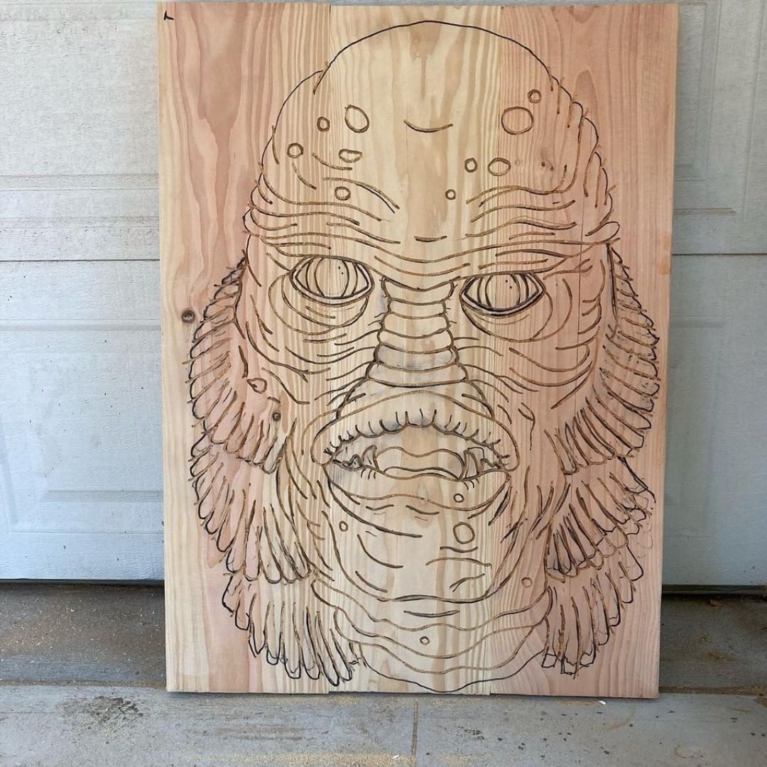 Creature mask design drawn on raw wood before carving by Rusty Anchor Trading